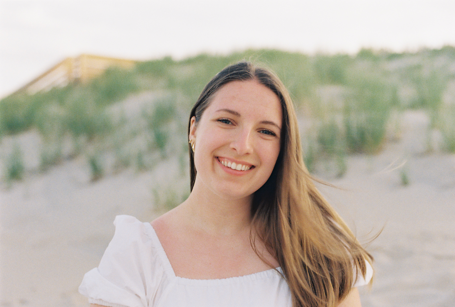 Lauren, founder of The Divorce Letters, smiling on the beach